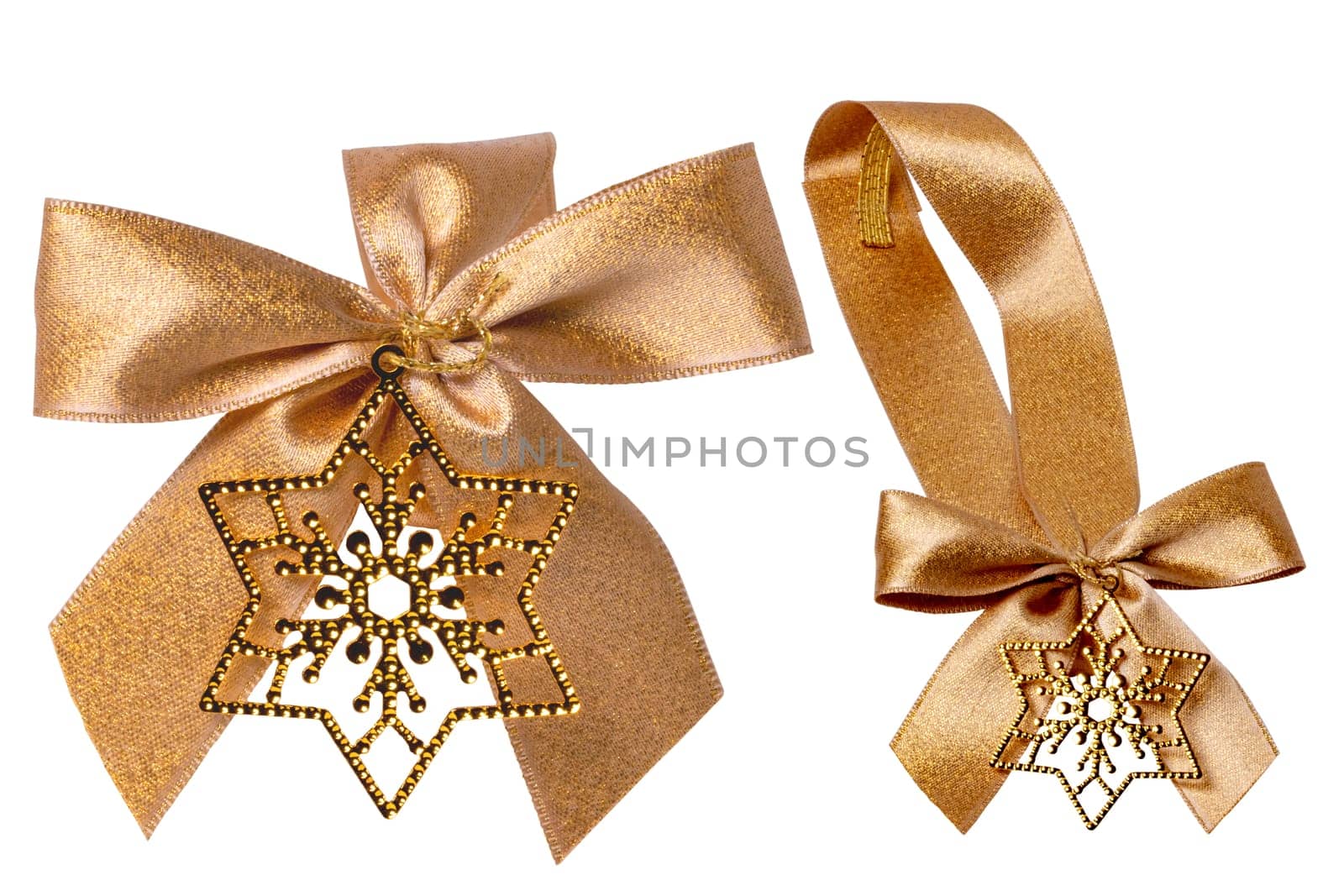 Gift bows. Closeup of a decorative golden ribbon bow made of silk for gift box isolated. Decorations background with star. Clipping path. Two views.