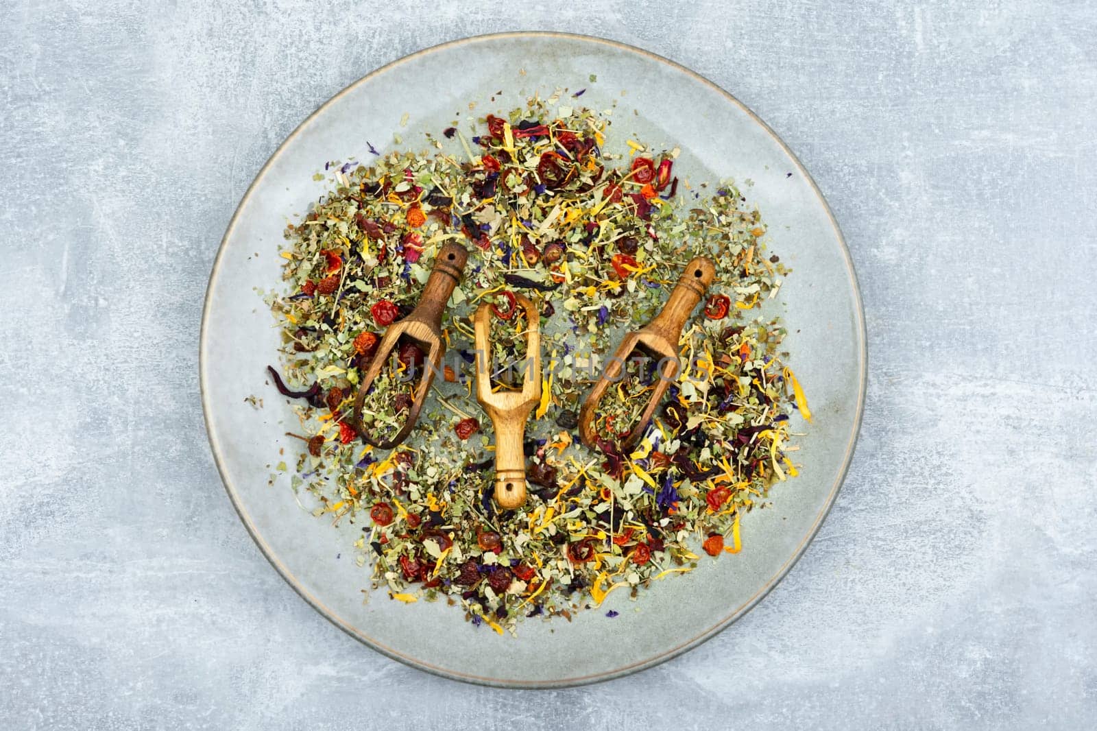 Herbal tea with healthy herbs in scoop. Natural herbal medicine. Flat lay