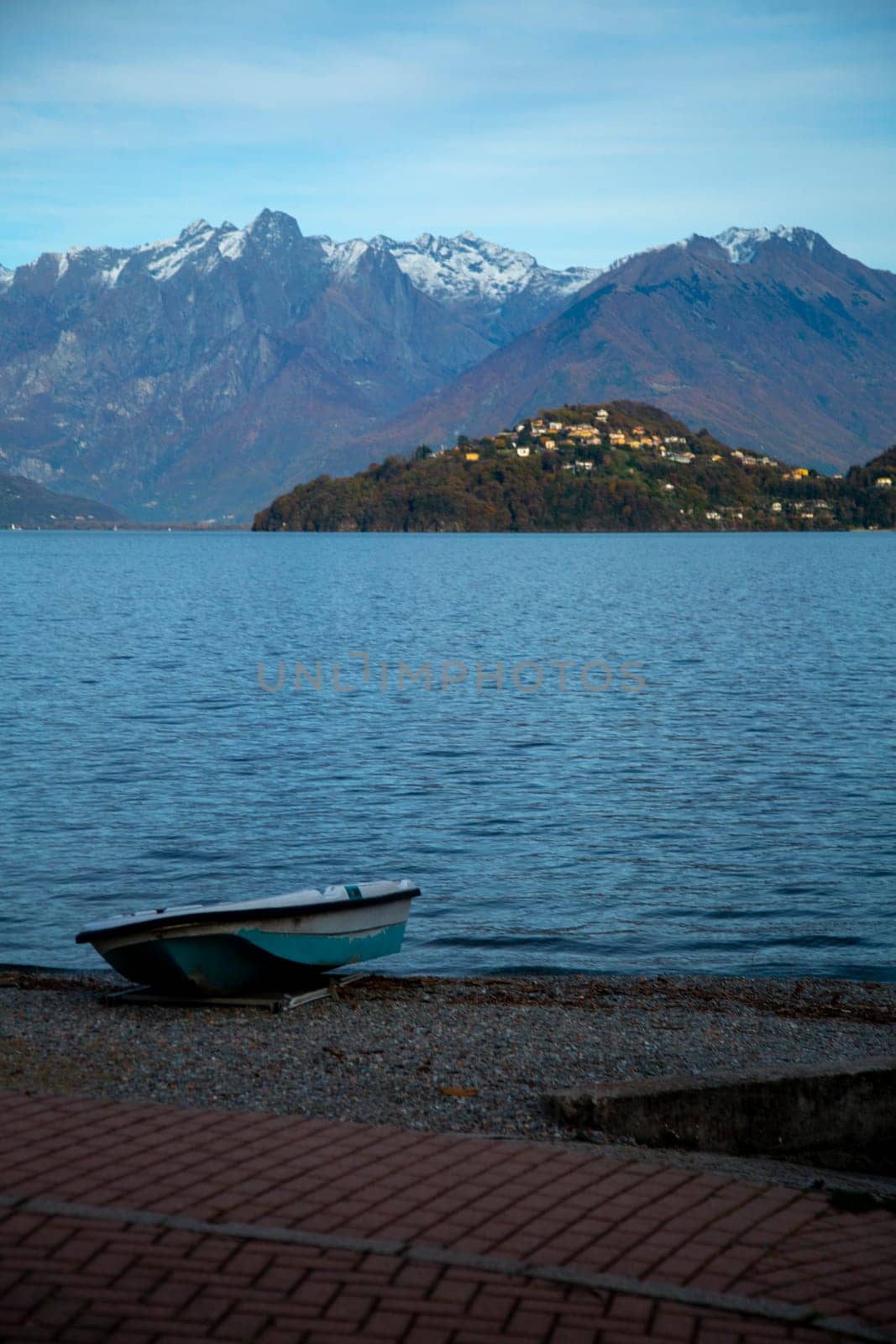 Boat on the beach of a lake, vertical view