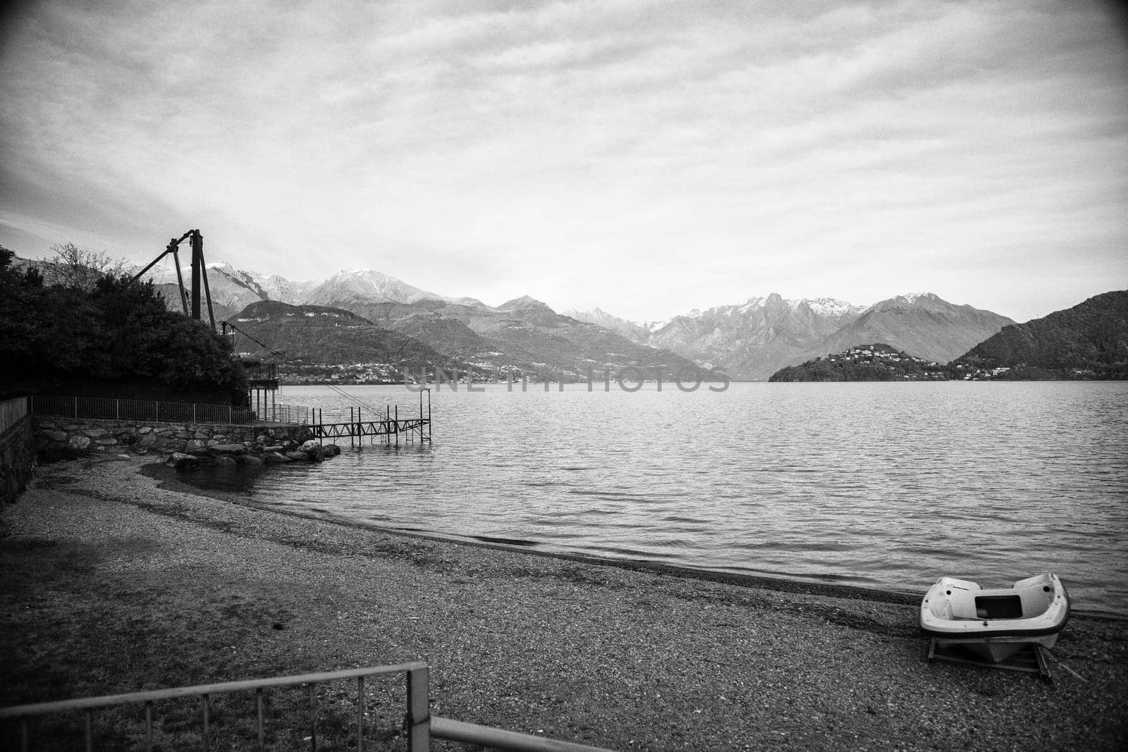 Lake view with boat on the beach, landscape view, black and white