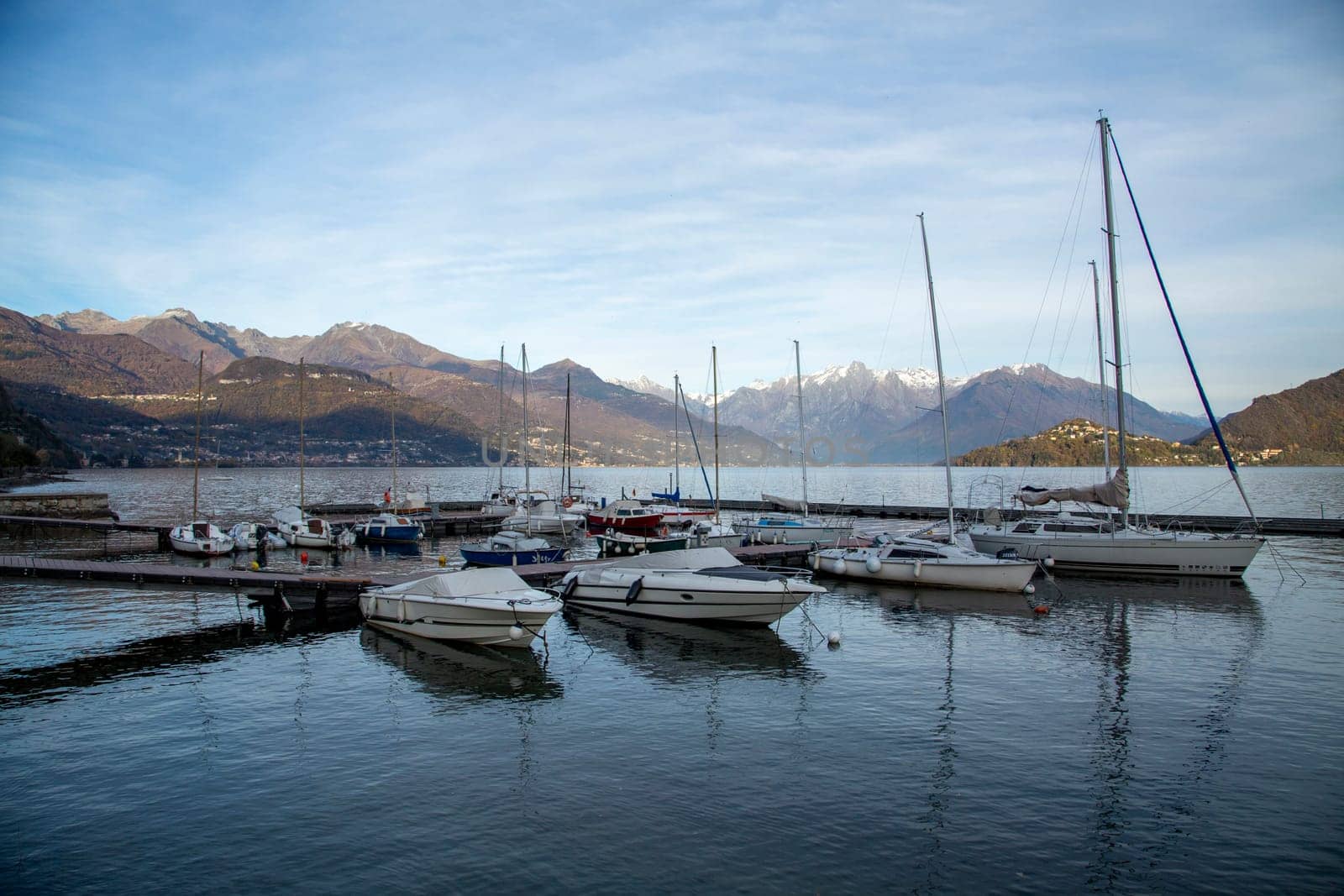 Small harbour and pier with boats on the lake