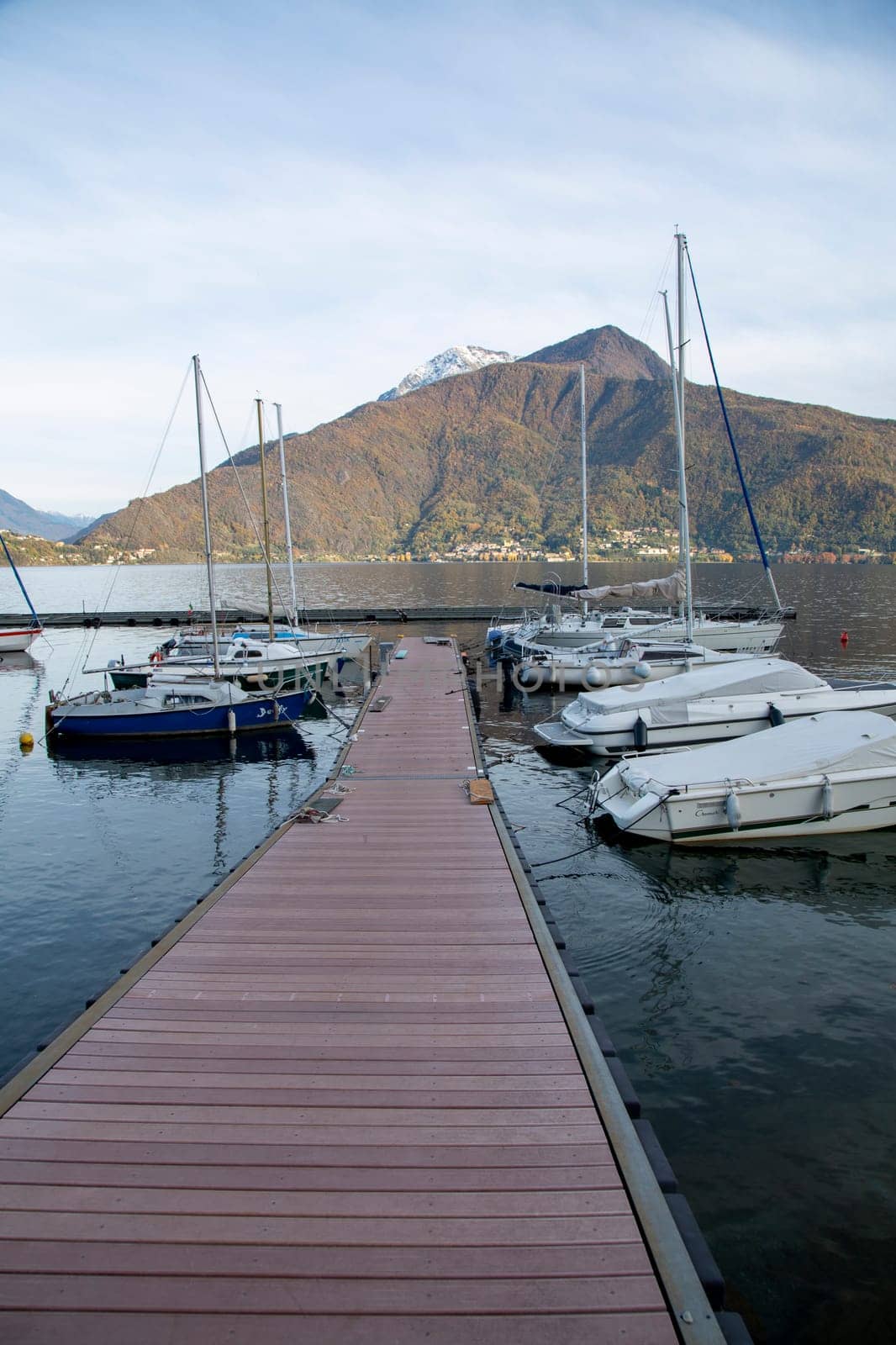 Small harbour and pier with boats on the lake