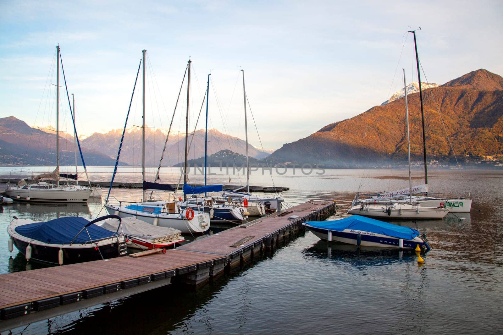 Small harbour and pier with boats on the lake