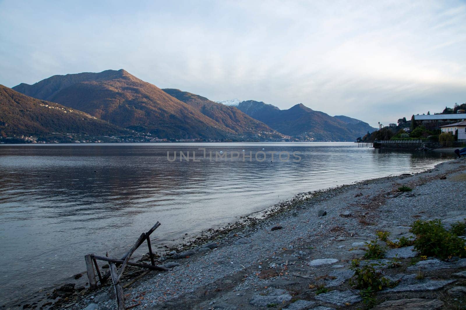 Lake and mountains under sunset light, landscape view