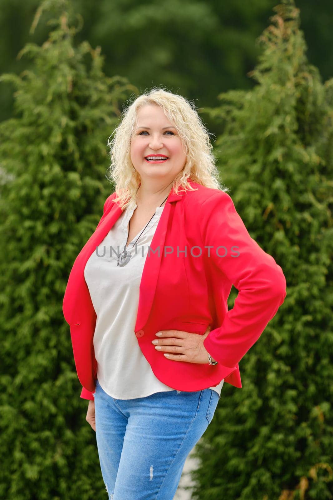 Lifestyle portrait of middle-aged woman outdoors