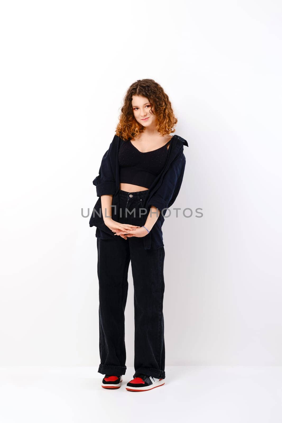 Cute teenager girl girl pretends to be embarrassed