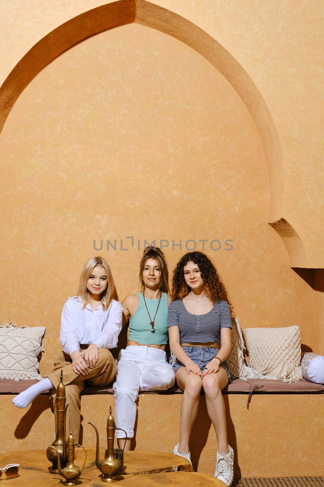 Happy family. Mother and her two daughters at vacation in Middle Eastern country.