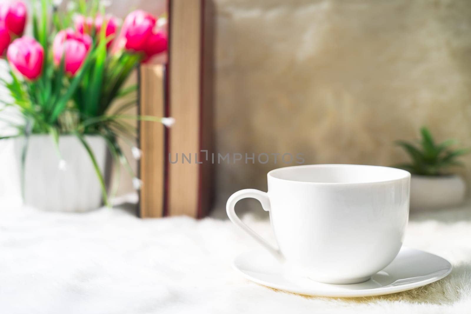 Coffee cup with book stacked on table,Coffee time in the morning