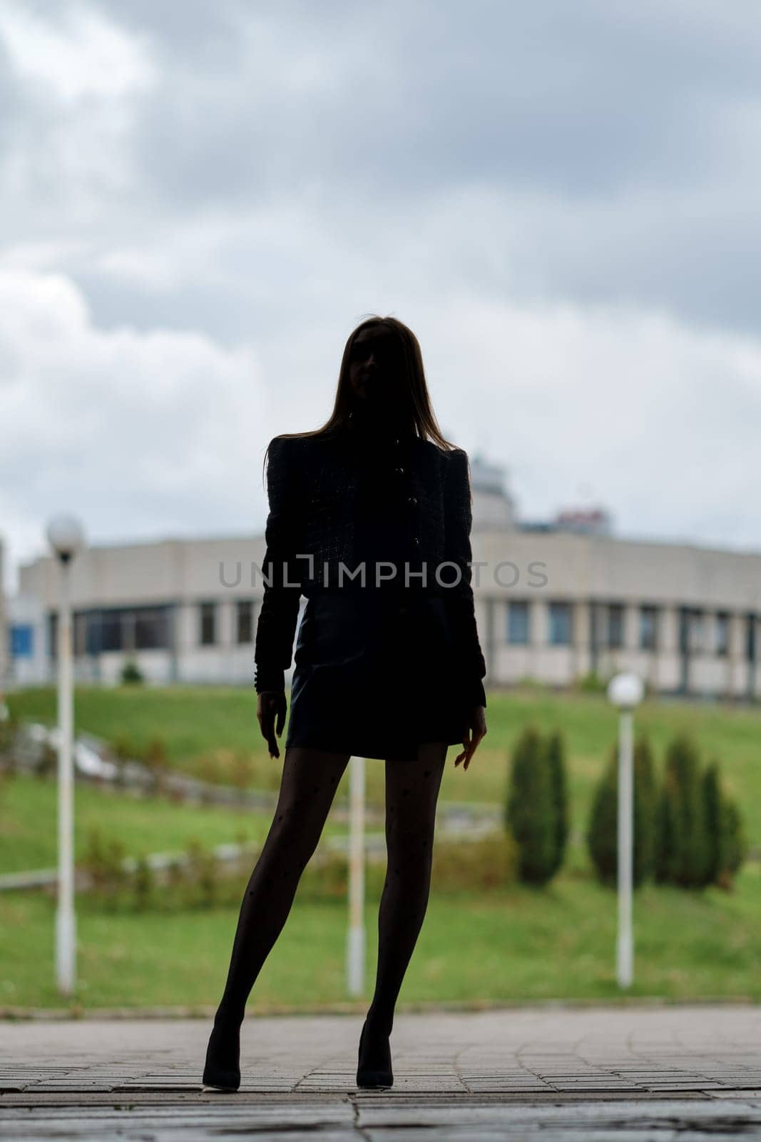 Full length urban portrait of unrecognizable woman outdoors