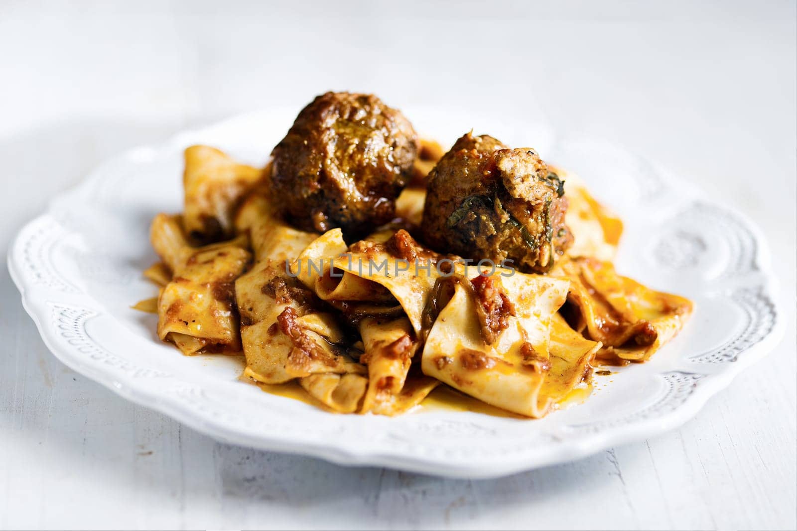 rustic italian tradtional comfort food pappardelle in meatball bolognese sauce