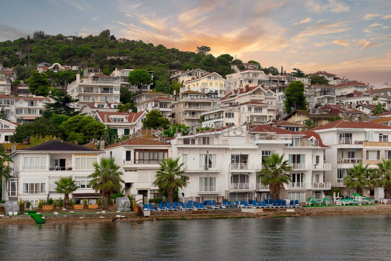 View of the mountains of Kinaliada island from Marmara Sea, with traditional summer houses and boats, Istanbul, Turkey