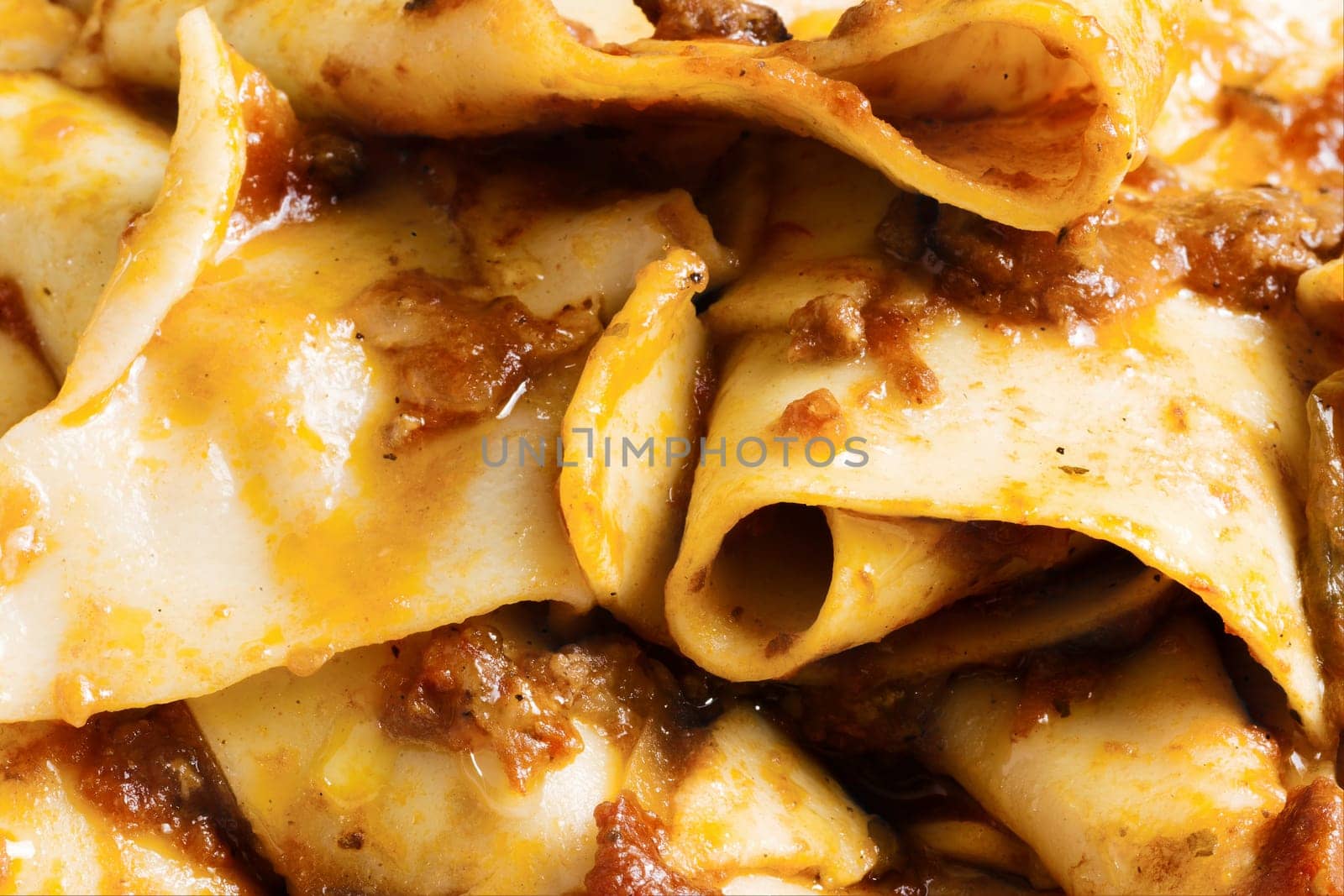 rustic italian tradtional comfort food pappardelle in bolognese sauce background
