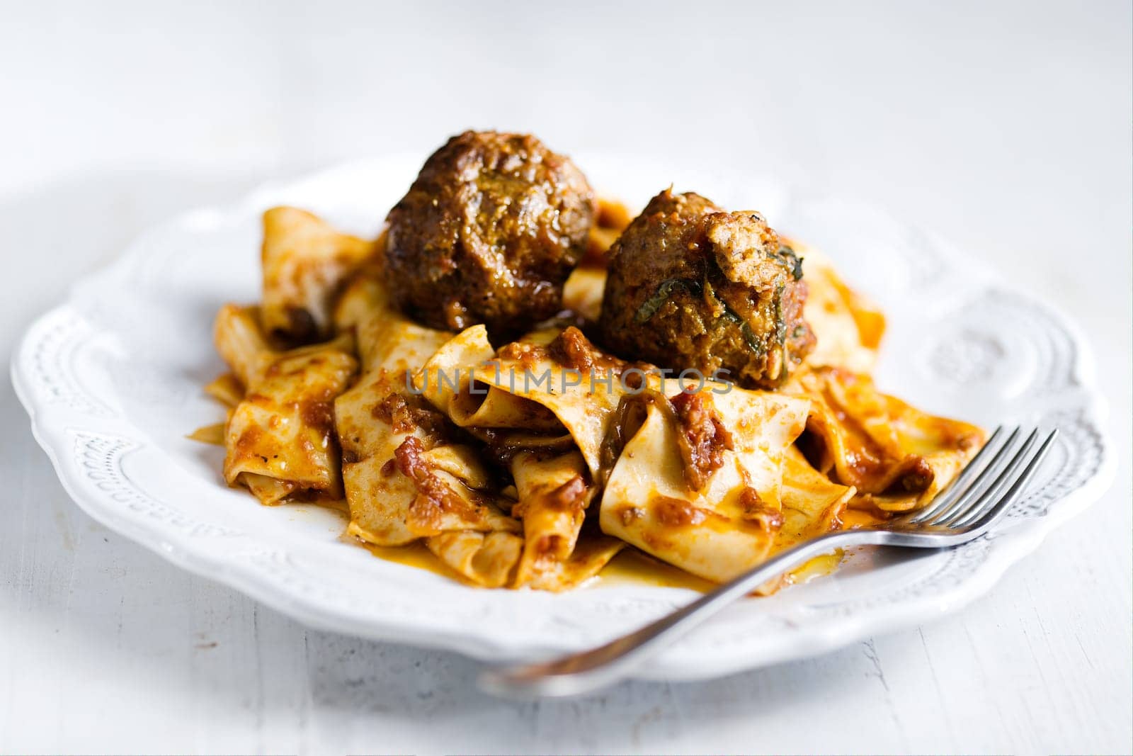 rustic italian tradtional comfort food pappardelle in meatball bolognese sauce