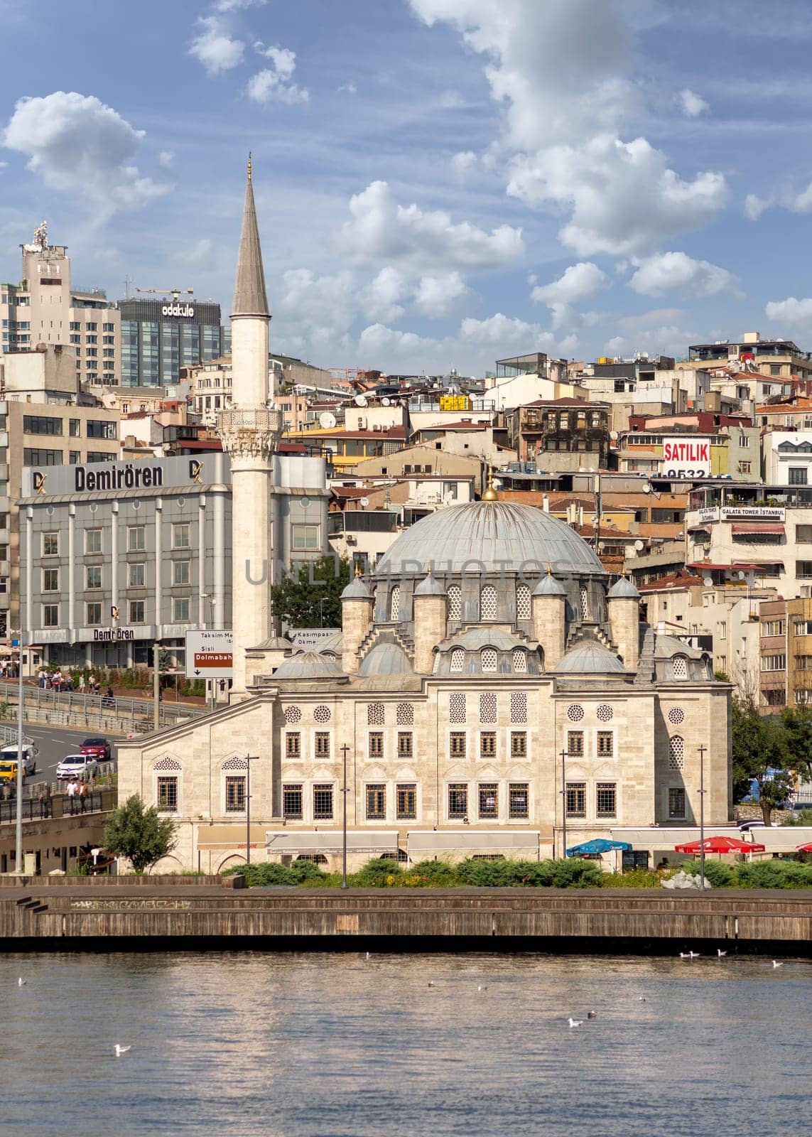 Istanbul, Turkey - September 1, 2022: View from Golden Horn overlooking Ottoman imperial Sokollu Mehmed Pasha Mosque, suited beside Ataturk Bridge, at Azapkapi neighborhood of Beyoglu district