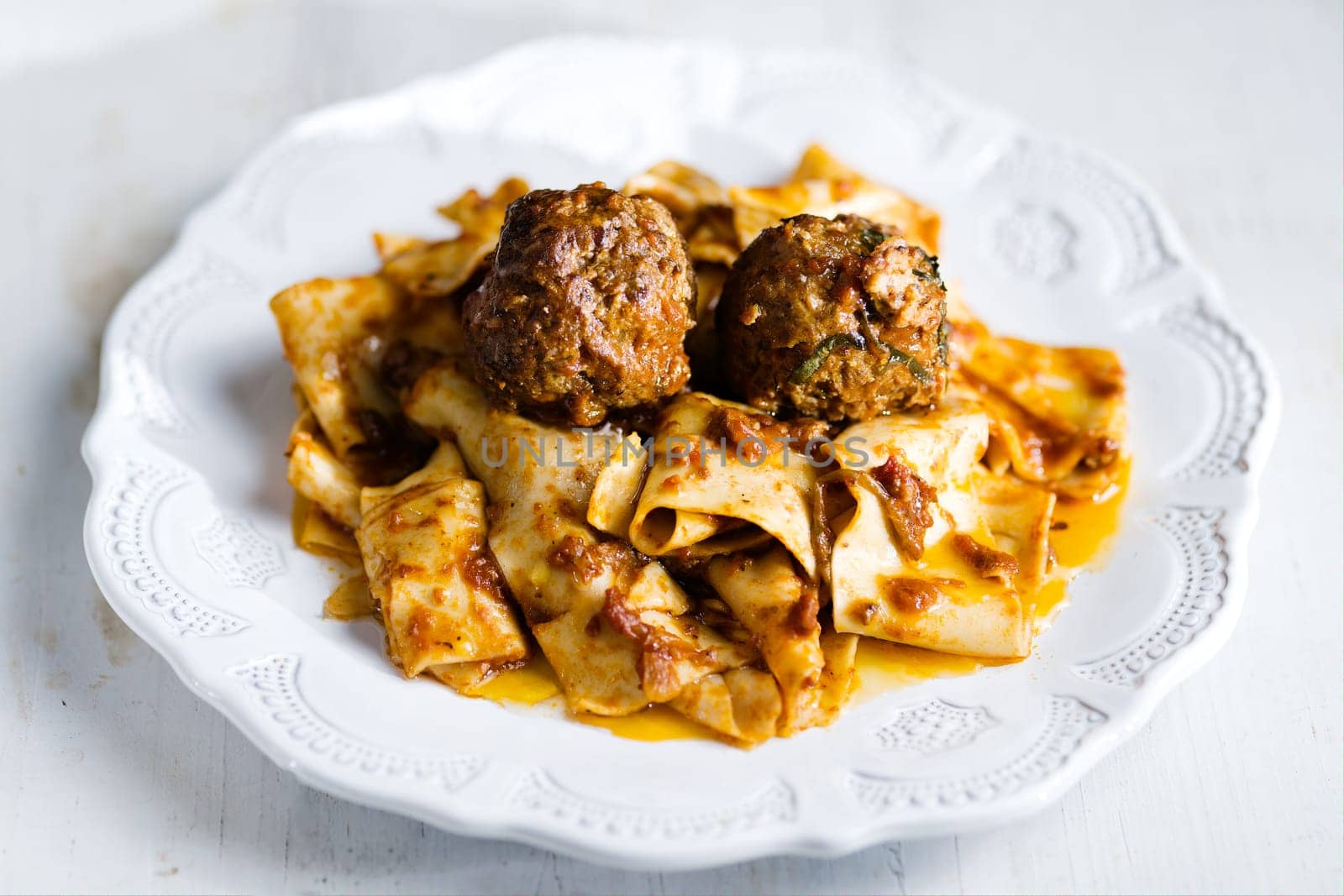 rustic italian tradtional comfort food pappardelle in meatball bolognese sauce