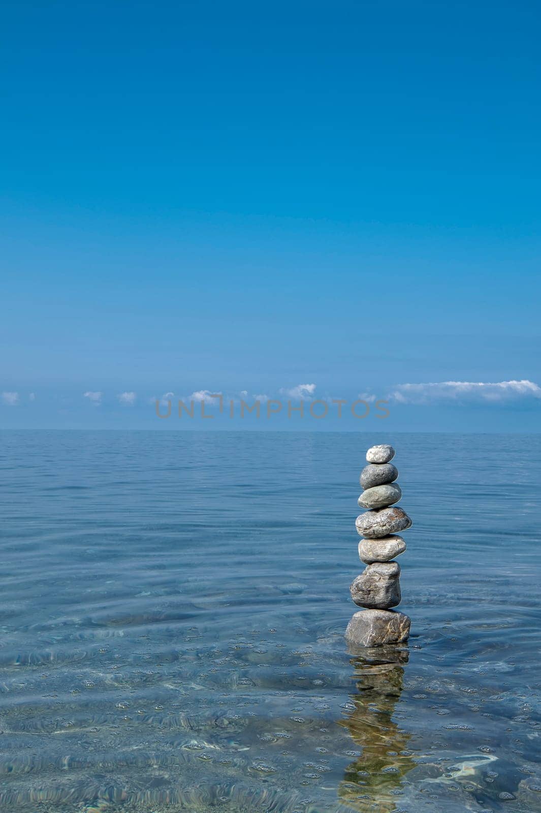 balanced stones on the rocks of the sea....................................