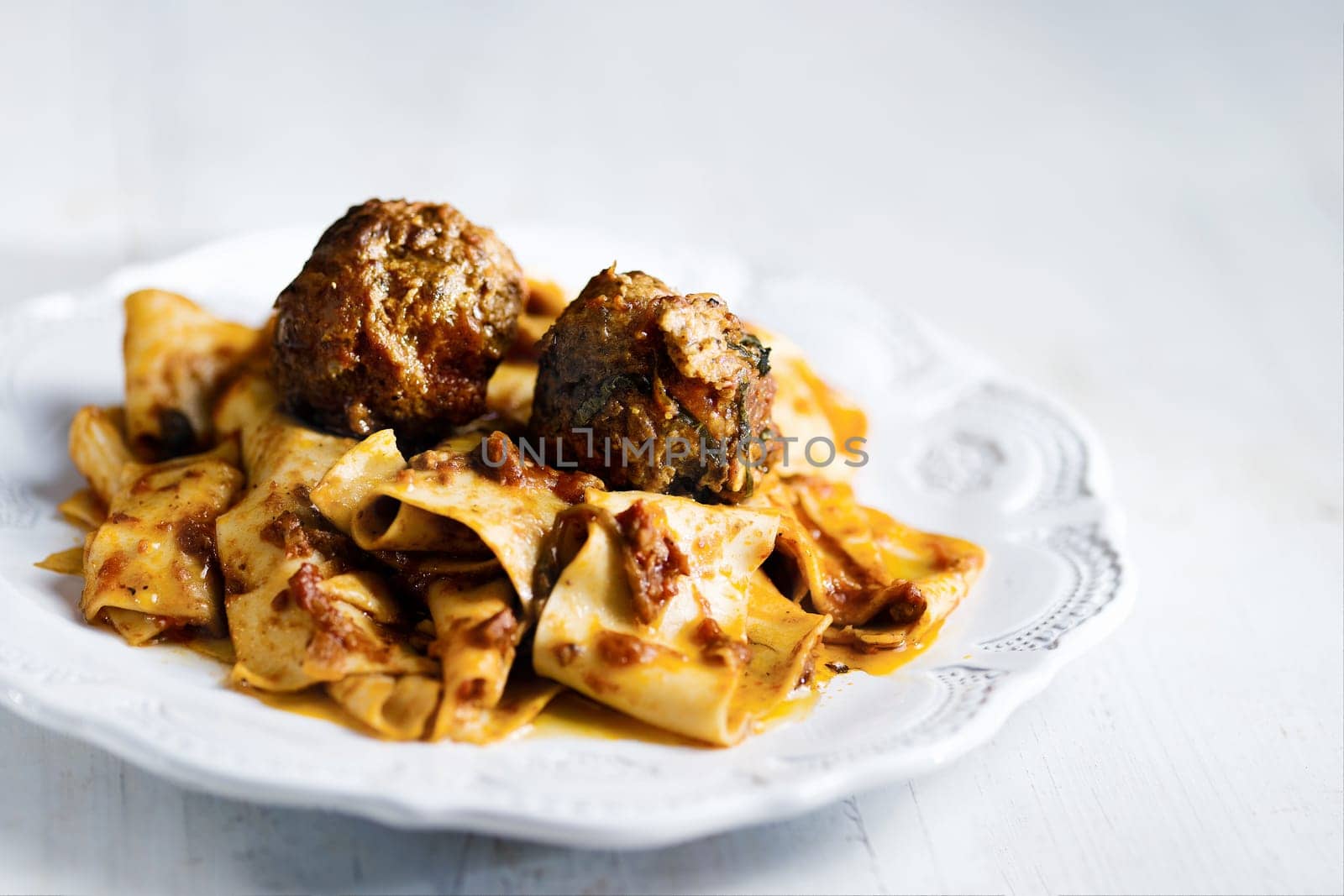 rustic italian tradtional comfort food pappardelle in meatball bolognese sauce