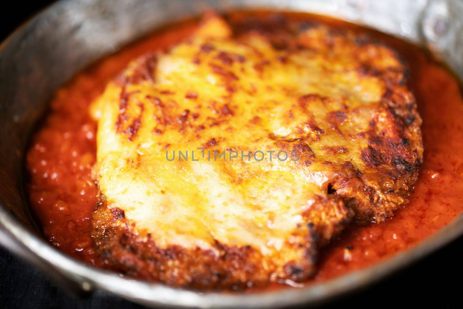 closeup of pan of rustic italian chicken parmesan comfort food