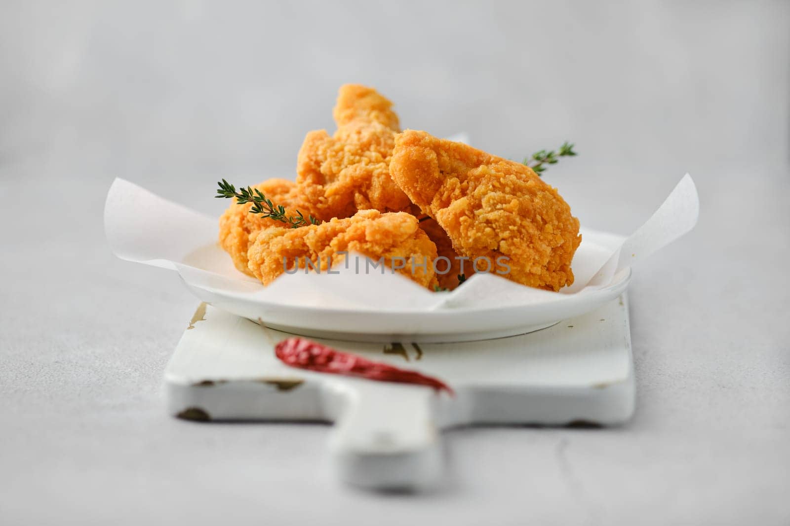Closeup photo with shallow depth of field of deep fried spicy chicken meat