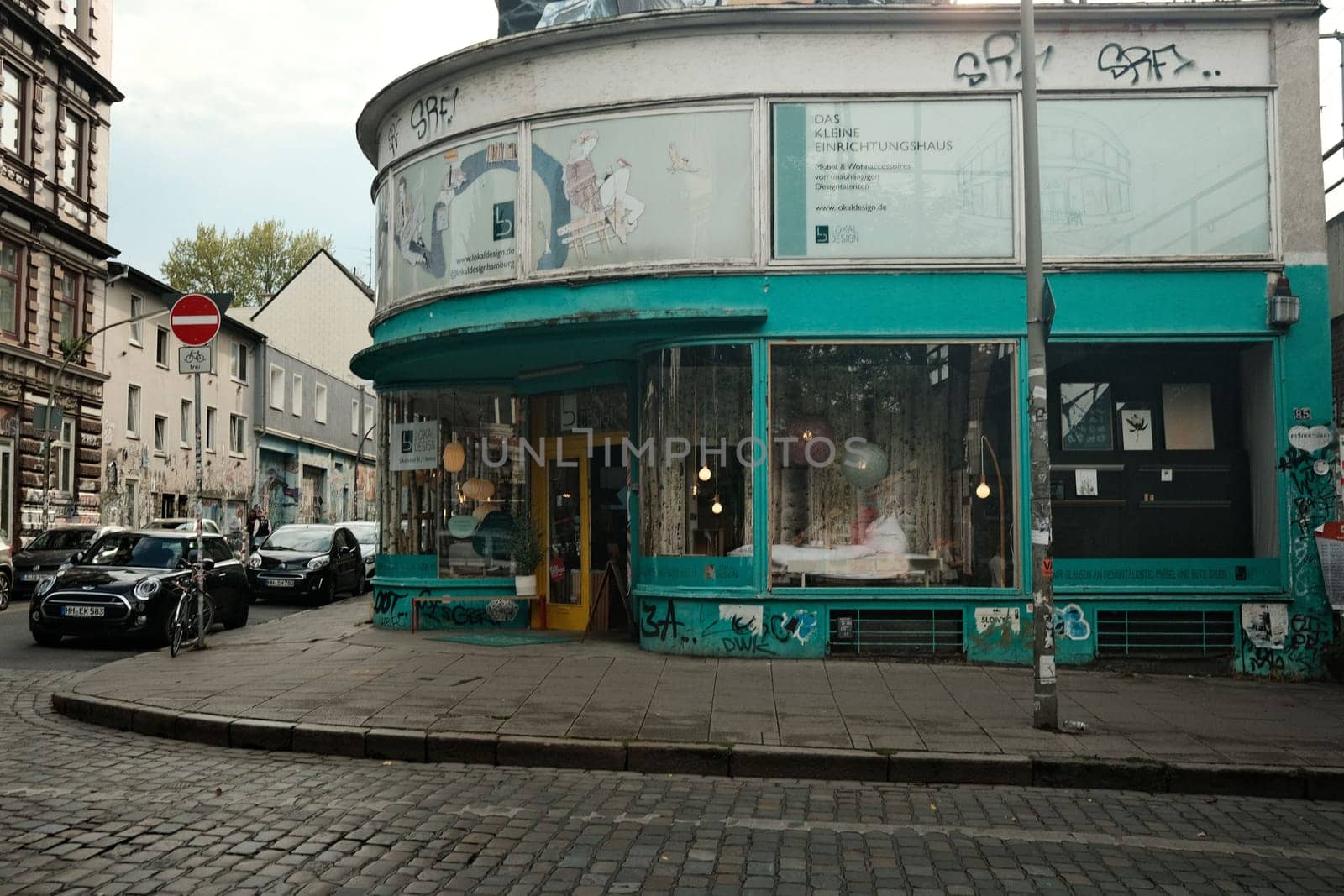 Turquoise house with glass facade in Hamburg, Germany