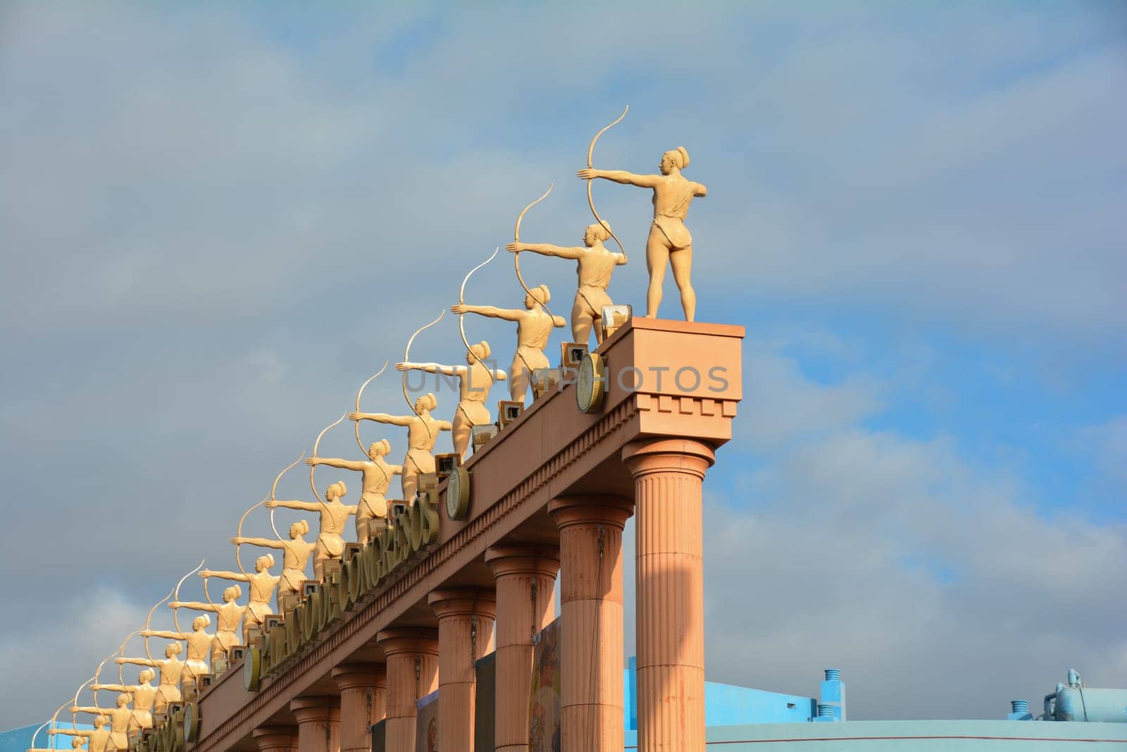 Hard Rock Cafe, Playa de la Americas, Tenerife, Spain August 12, 2022 - Archers stone figures and blue sky