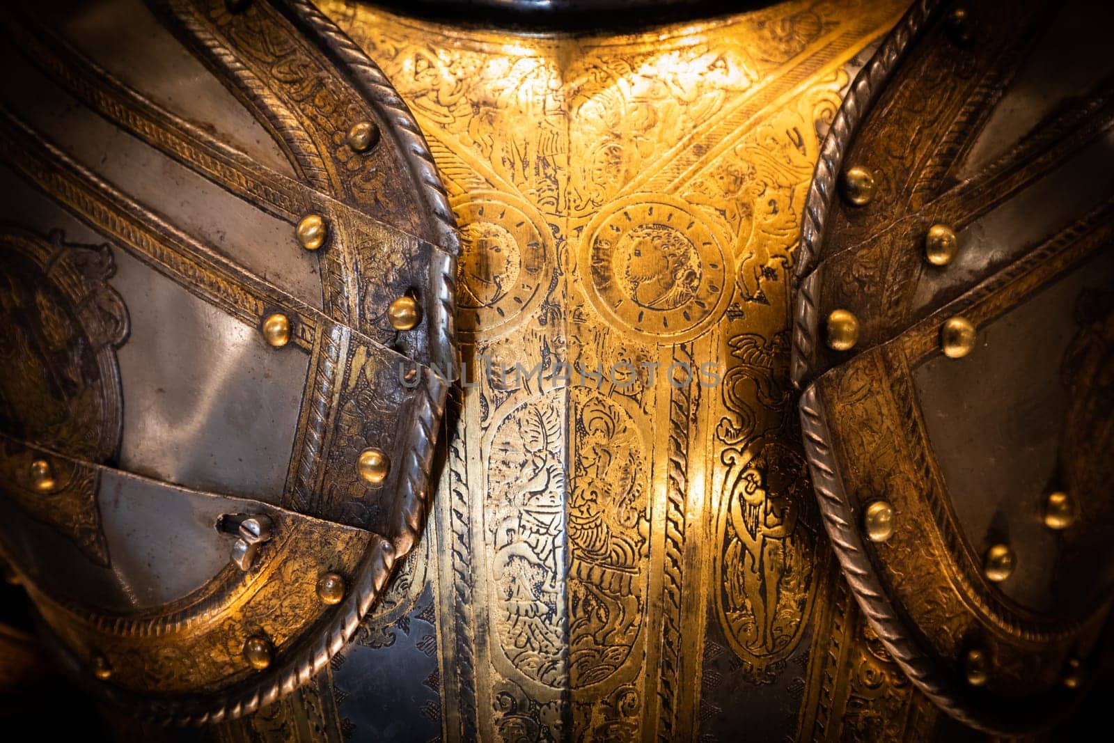 Antique armour on black background. Concept for security, safety and fantasy