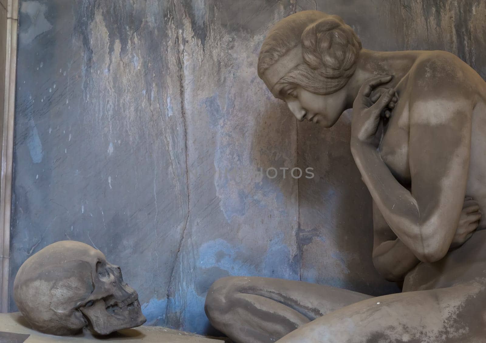 GENOA, ITALY - June 2020: antique statue, beginning 1800, made of marble, in a Christian Catholic cemetery - Italy
