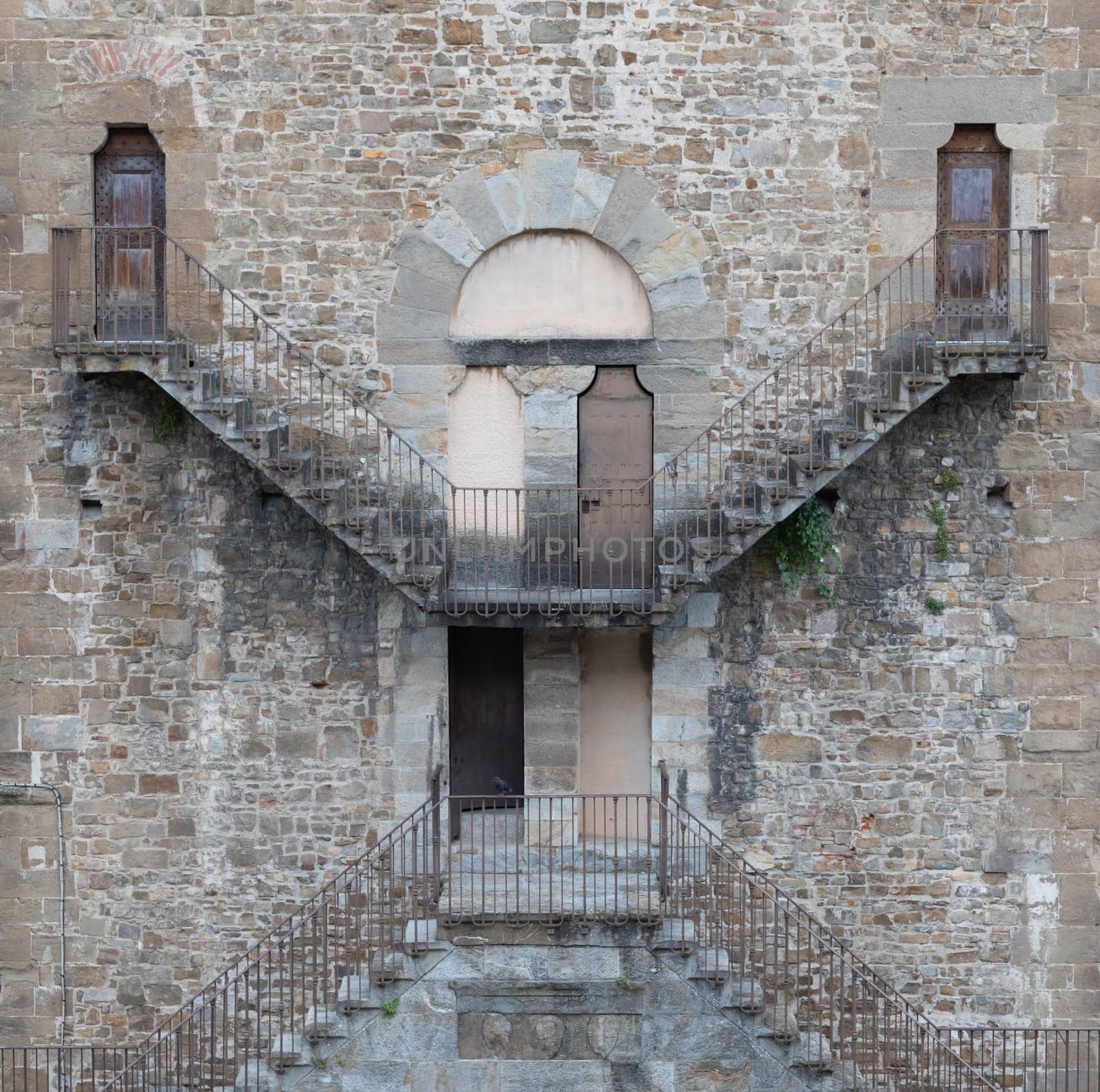 Exterior of antique building with Escher architecture style. Simmetry and geometric perspective.