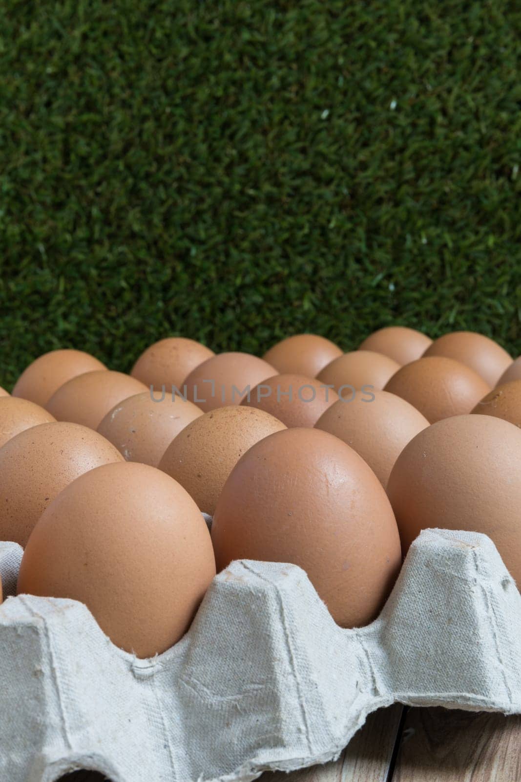 Perspective view of a big group of chicken eggs.