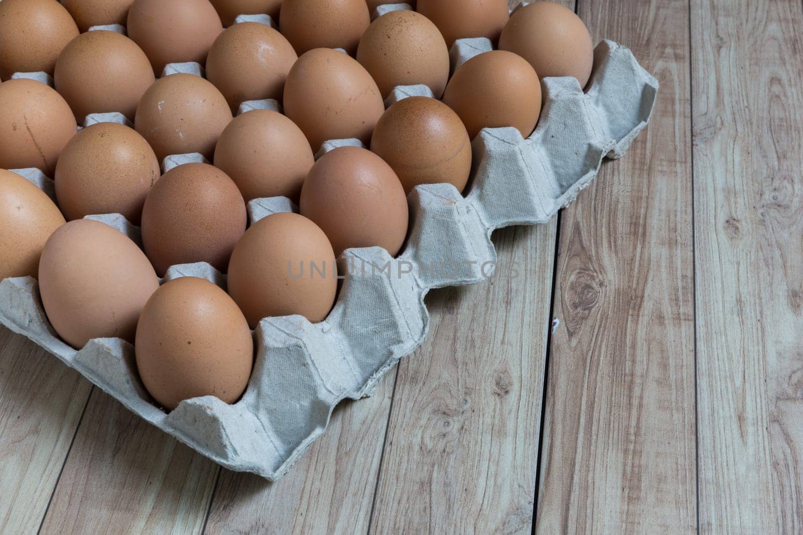 Perspective view of a big group of chicken eggs.