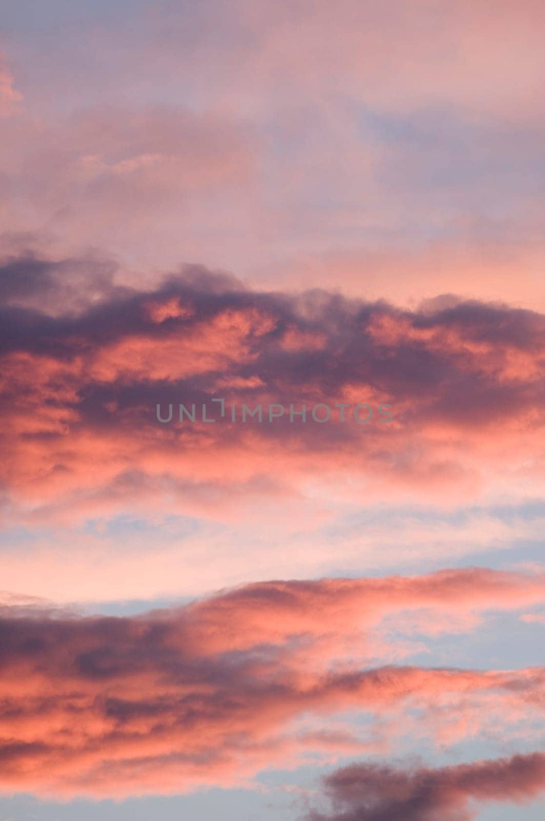 format-filling view of an atmospheric sky with clouds in the evening light