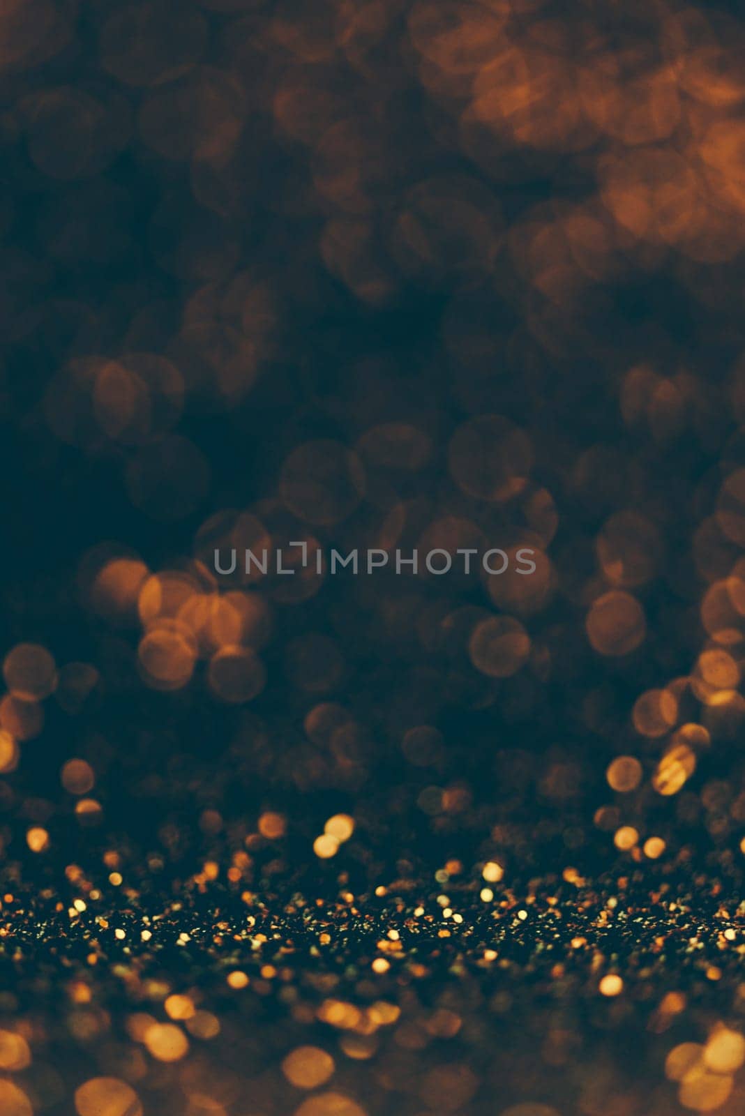 Blur neon gold and blue light circle background. Sparkling firework bokeh dots in vintage style. Luxury and classy new year and christmas celebration party textured dark backdrop. Blurry golden dust.