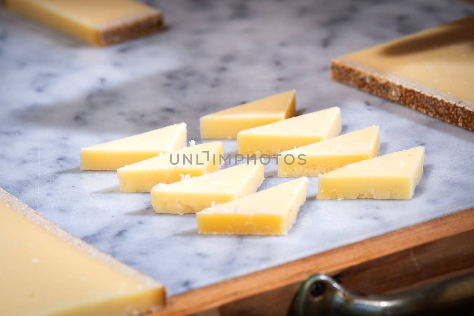 funny tasted pieces of cheese for lunch or apperitive on a marble table