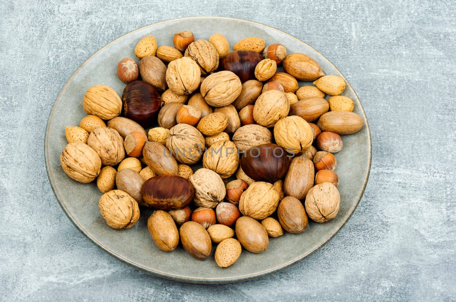 Walnut, chestnut, almond, hazelnut on the table.Healthy food and snacks