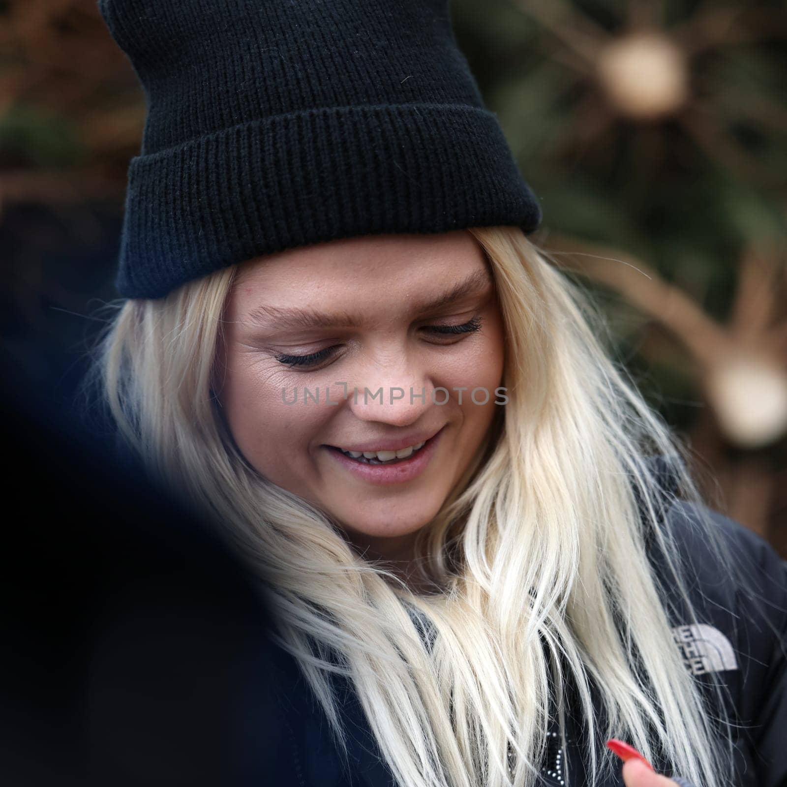 Krakow, Poland - Dec 19, 2021: Margaret during the distribution of Christmas trees at Szczepanski Square in Krakow