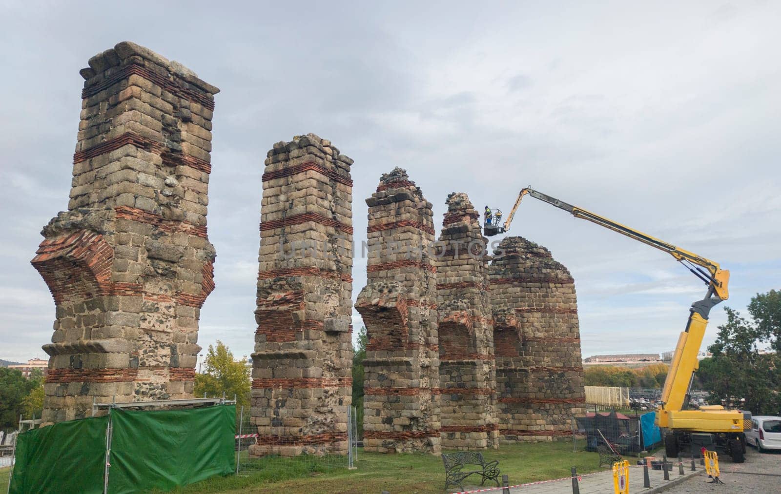 Telescopic boom working at Roman Aqueduct Los Milagros, Merida, Spain. Ancient architecture preserving works concept