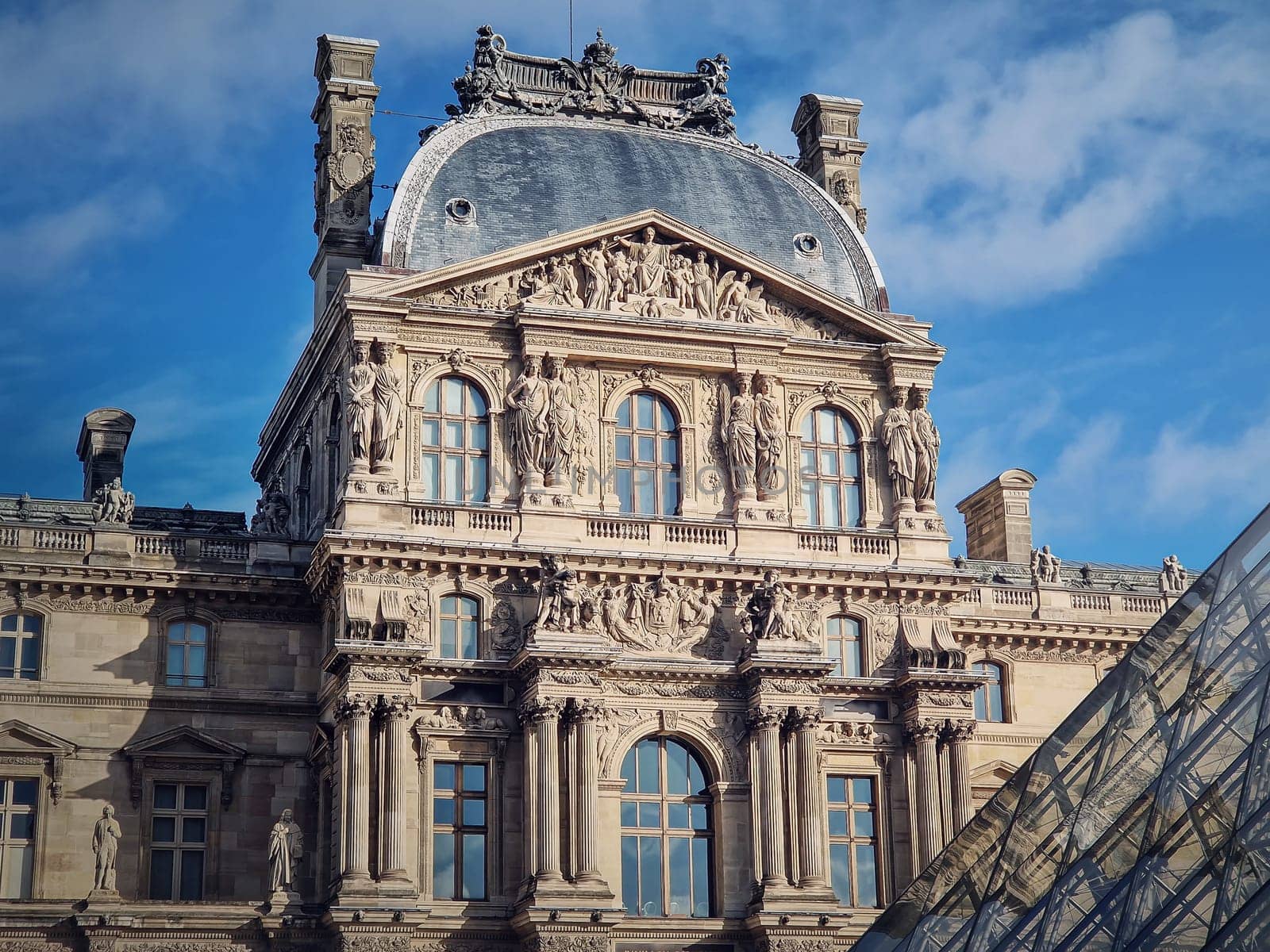 Closeup Louvre building, outdoors facade view of the famous museum palais in Paris, France.