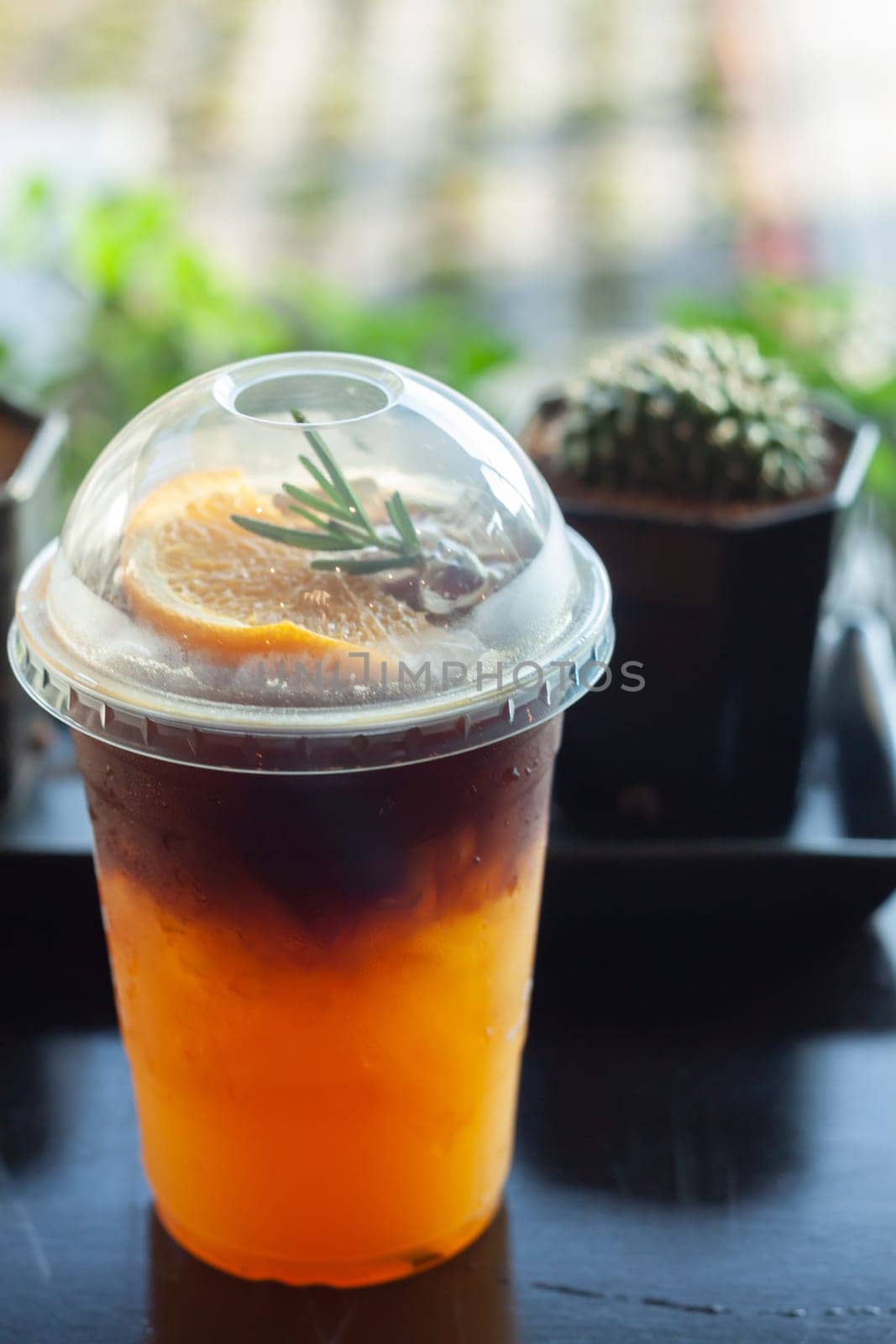 Glass of americano mixed with orange juice, stock photo