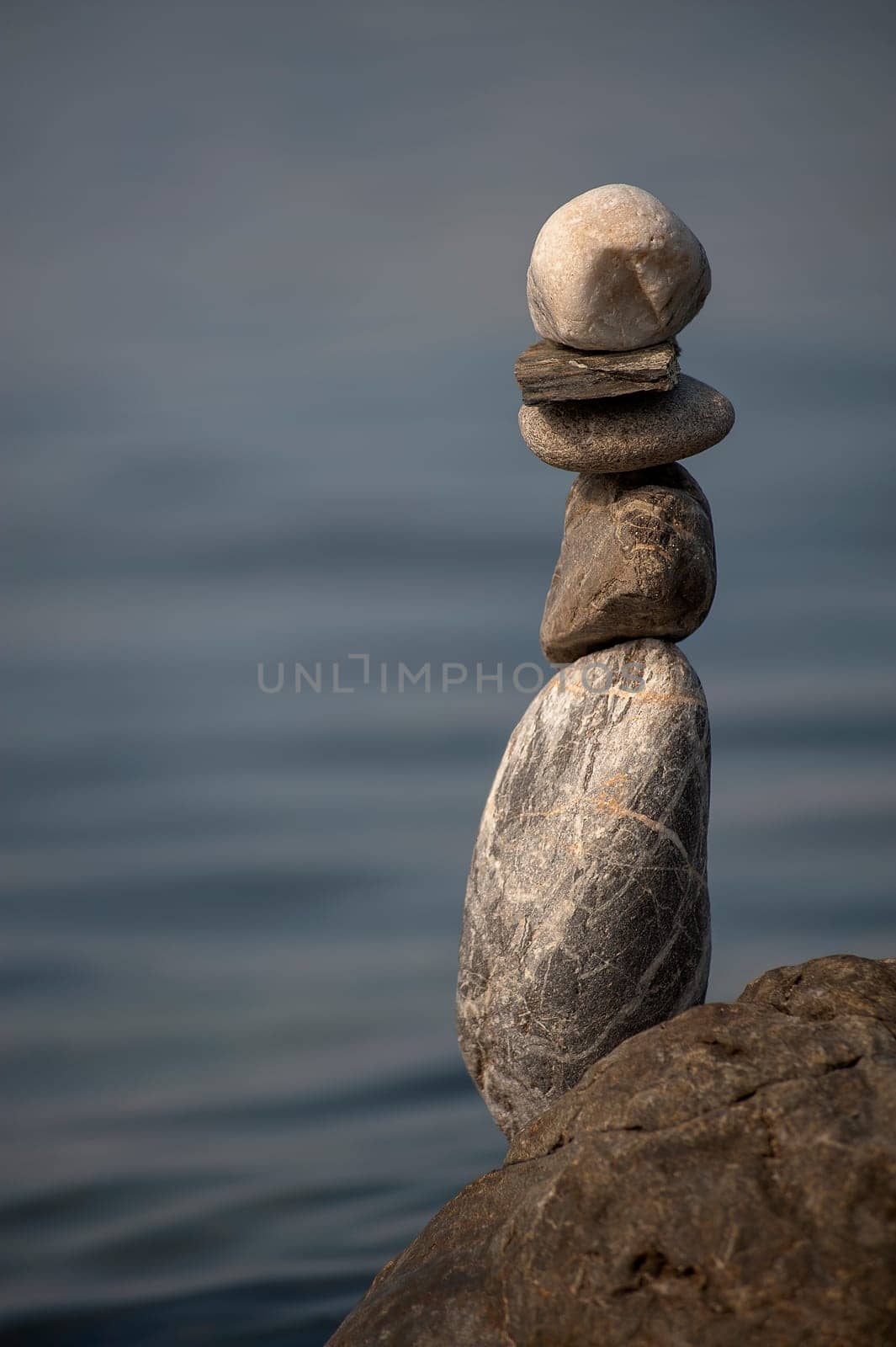 balanced stones on the rocks of the sea..