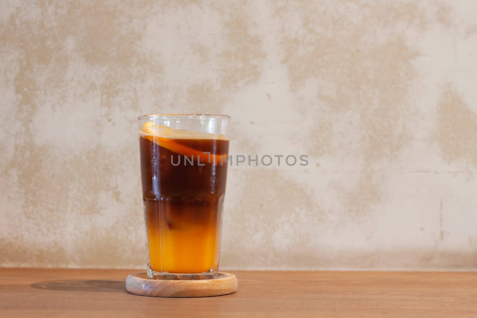 Glass of americano mixed with orange juice, stock photo