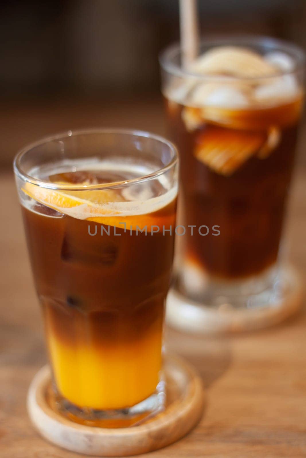 Glass of americano mixed with orange juice, stock photo