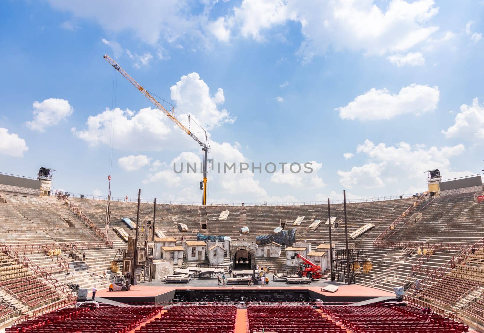 Verona, Italy - June 2022: workers preparing the stage for the thetre performance in the famous Arena