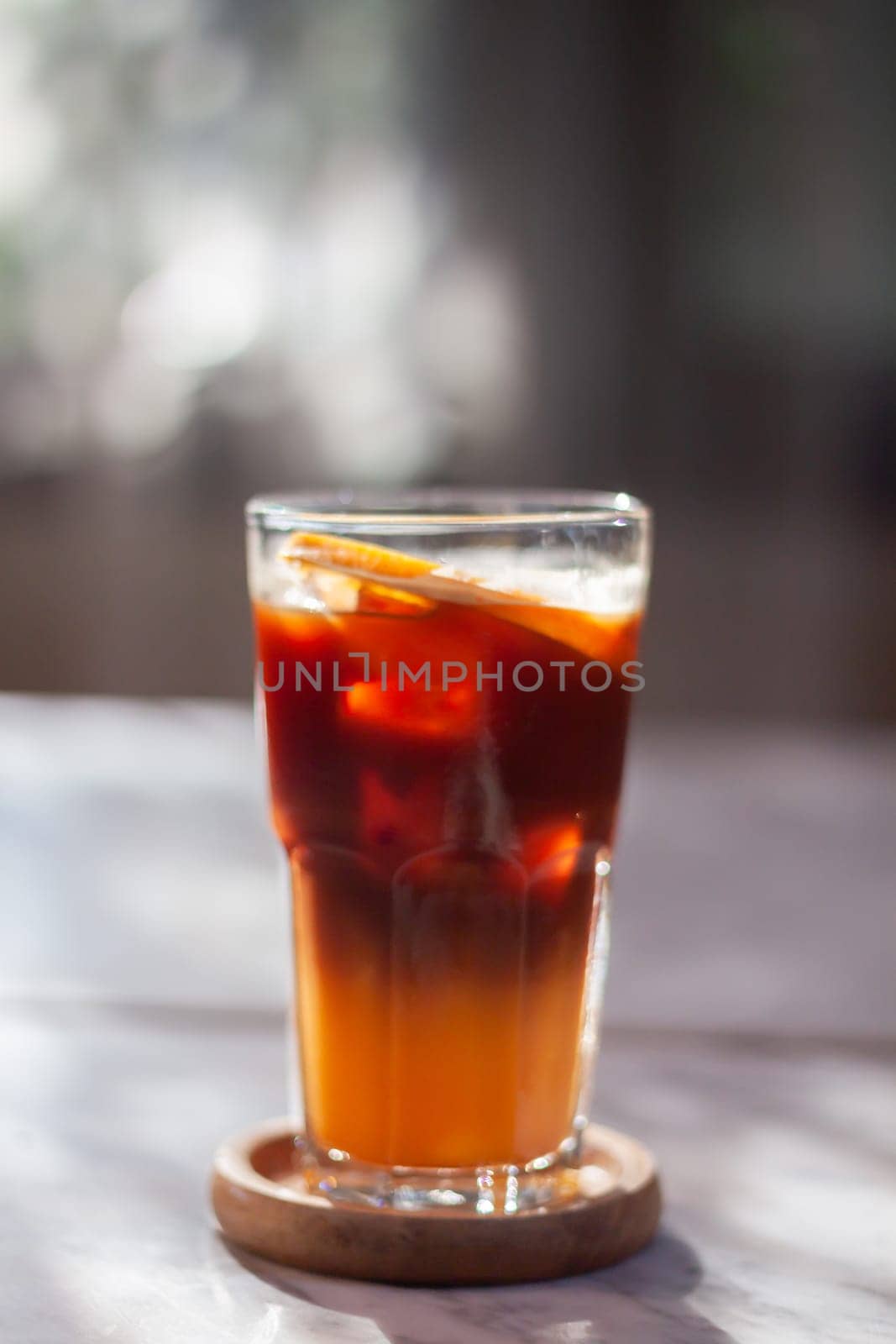 Glass of americano mixed with orange juice, stock photo