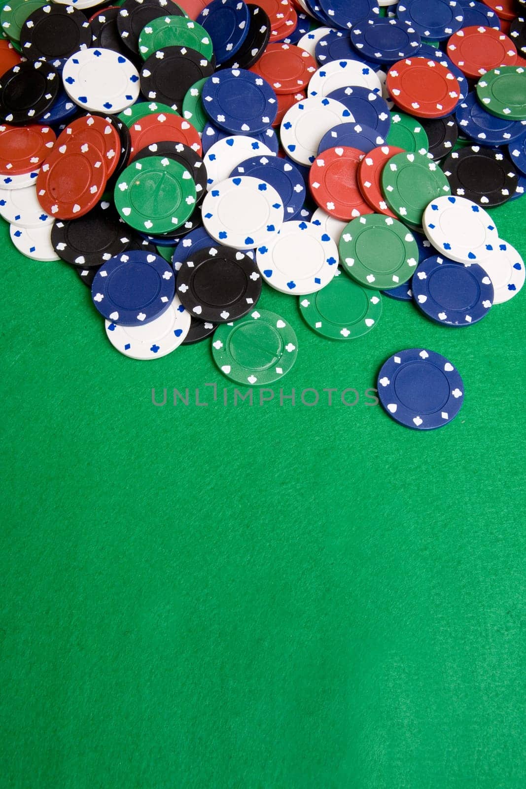 Casino chips on a green felt - background image