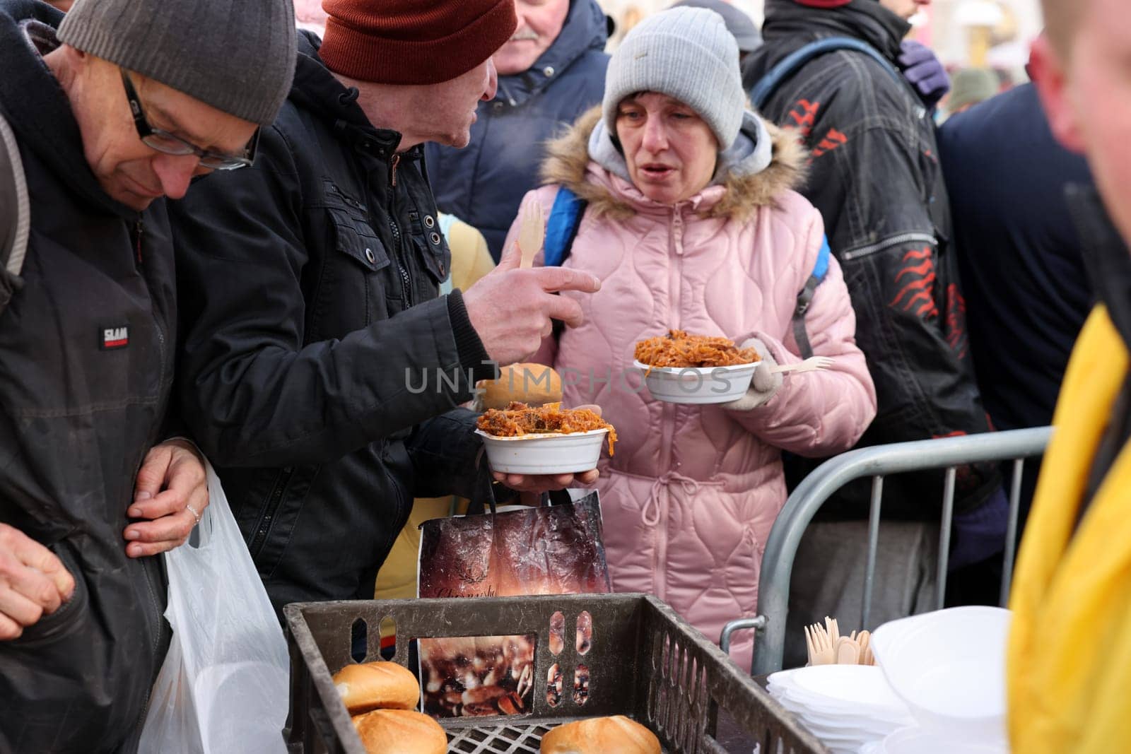 Krakow, Poland - Dec 18, 2022: Christmas Eve for poor and homeless on the Main Square in Cracow. The group Kosciuszko prepares the greatest eve in the open air in Krakow
