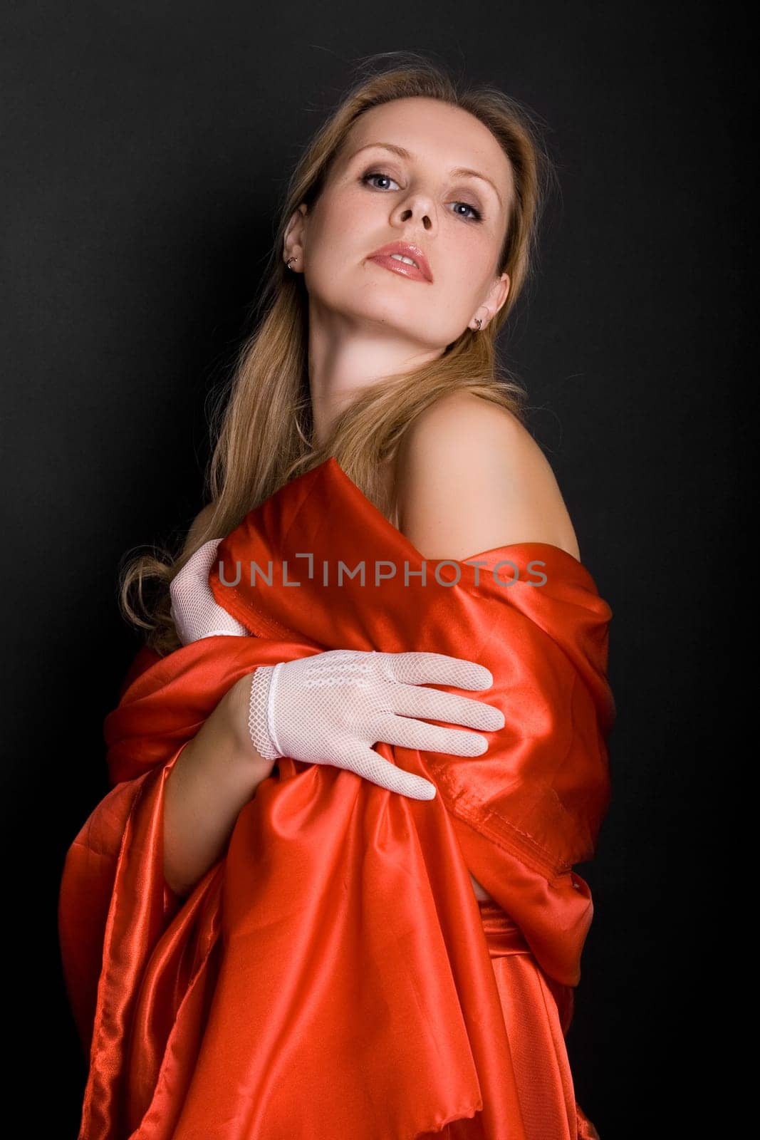 a glamorous looking woman in a fancy dress