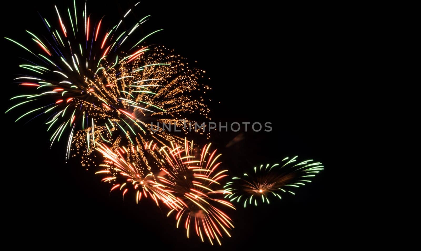 Colorful fireworks exploding in the night sky