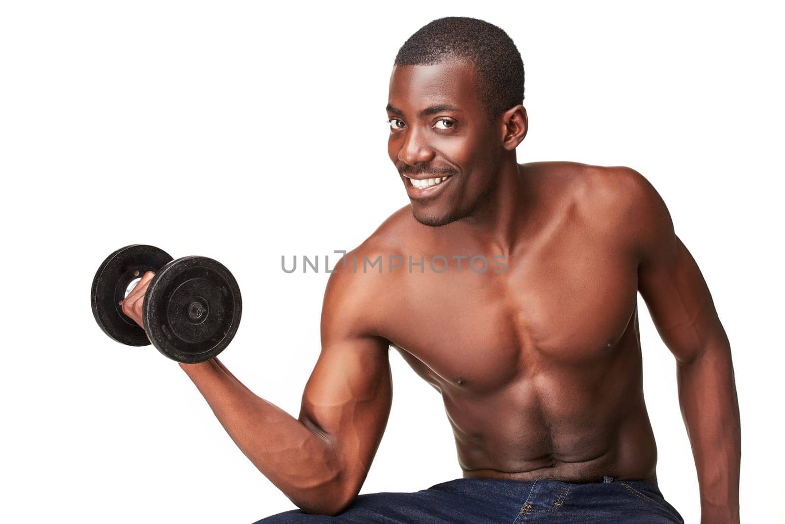 Strong and muscular smiling young black african man with dumbbell isolated on white background