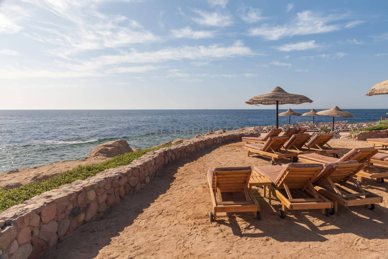 The beach at the luxury hotel, Sharm el Sheikh, Egypt. chairs and umbrellas