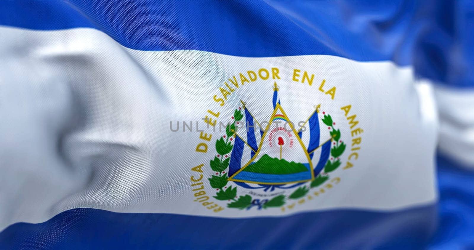 Close-up view of the El Salvador national flag waving in the wind. The Republic of El Salvador is a country in Central America. Fabric textured background. Selective focus. Realistic 3d illustration
